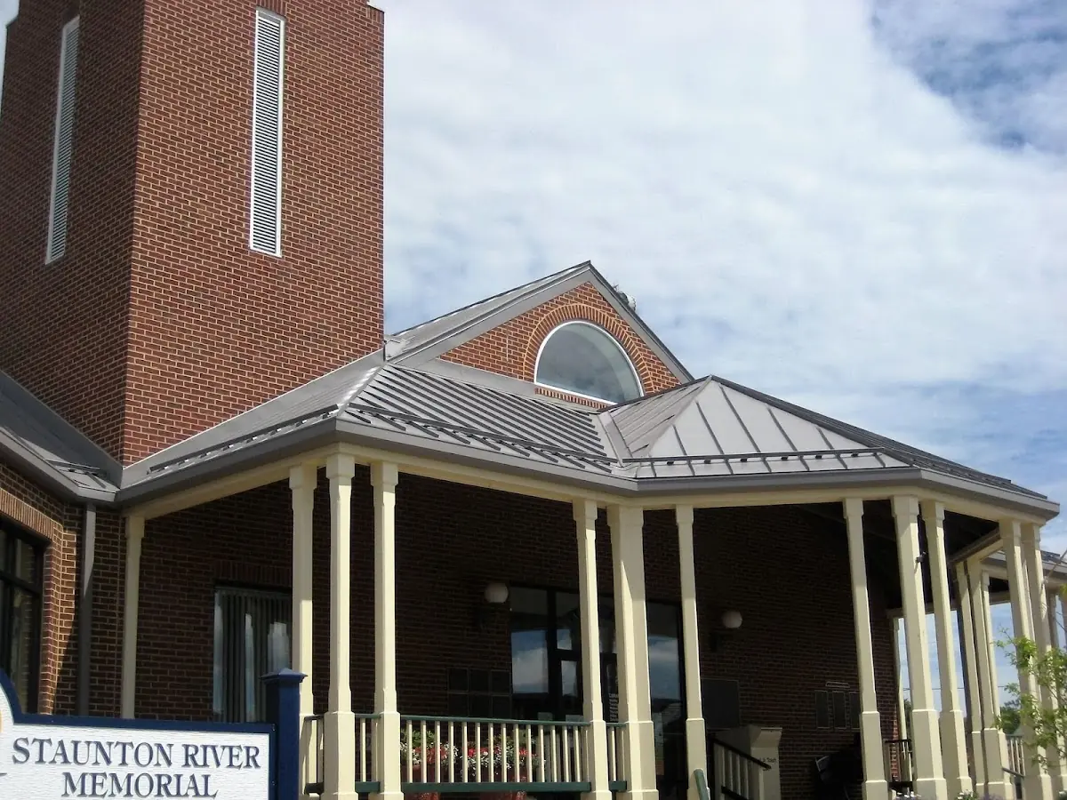 Skilled roofing craftsmen working on a residential roof in Amberly